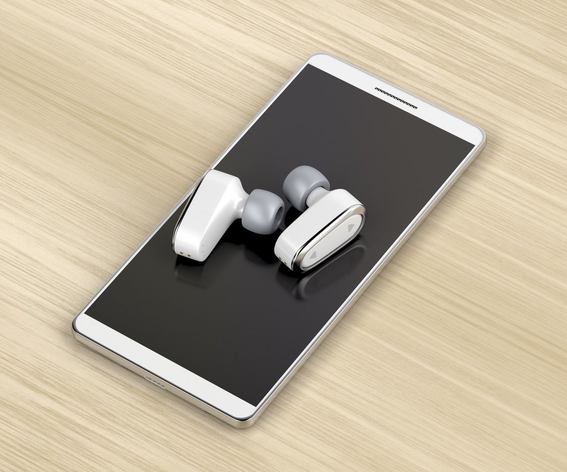 Wireless in-ear headphones and smartphone