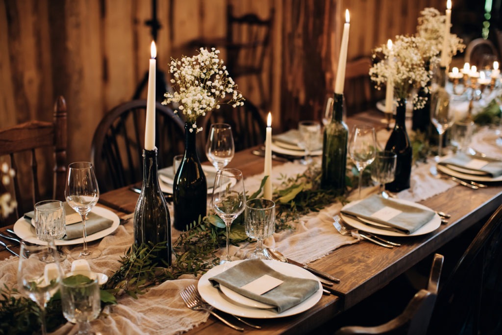 Romantic wedding table setting rustic style with candles. DIY Decorating ideas