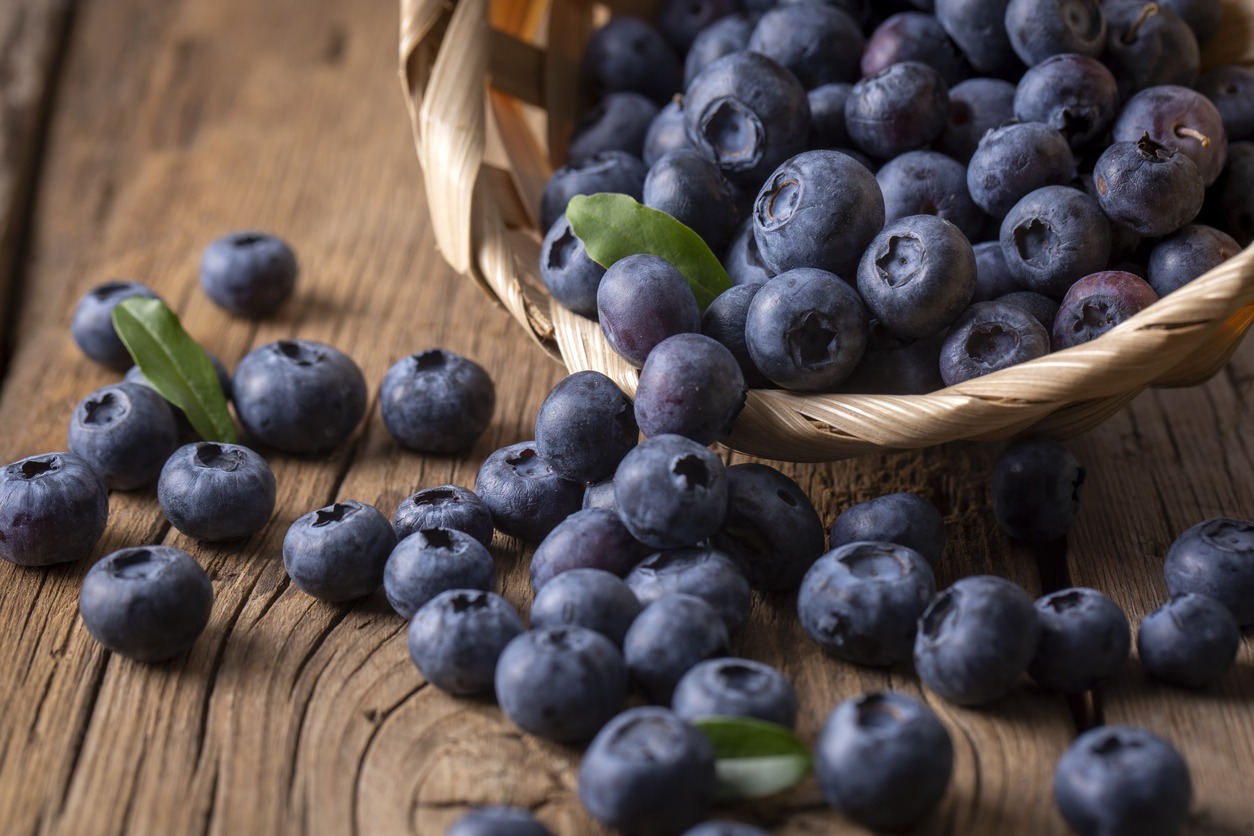 Blueberries in an basket on a wooden table