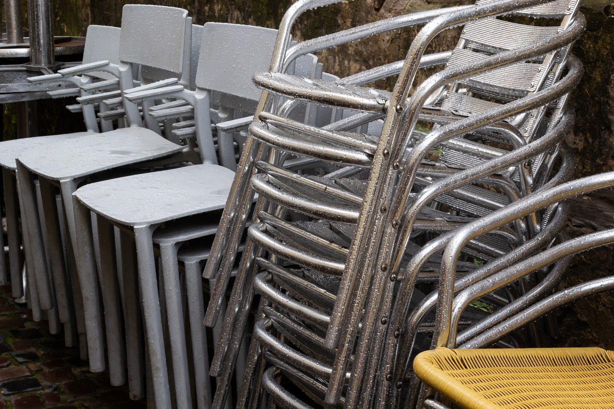 stainless steel armchairs stacked over each other
