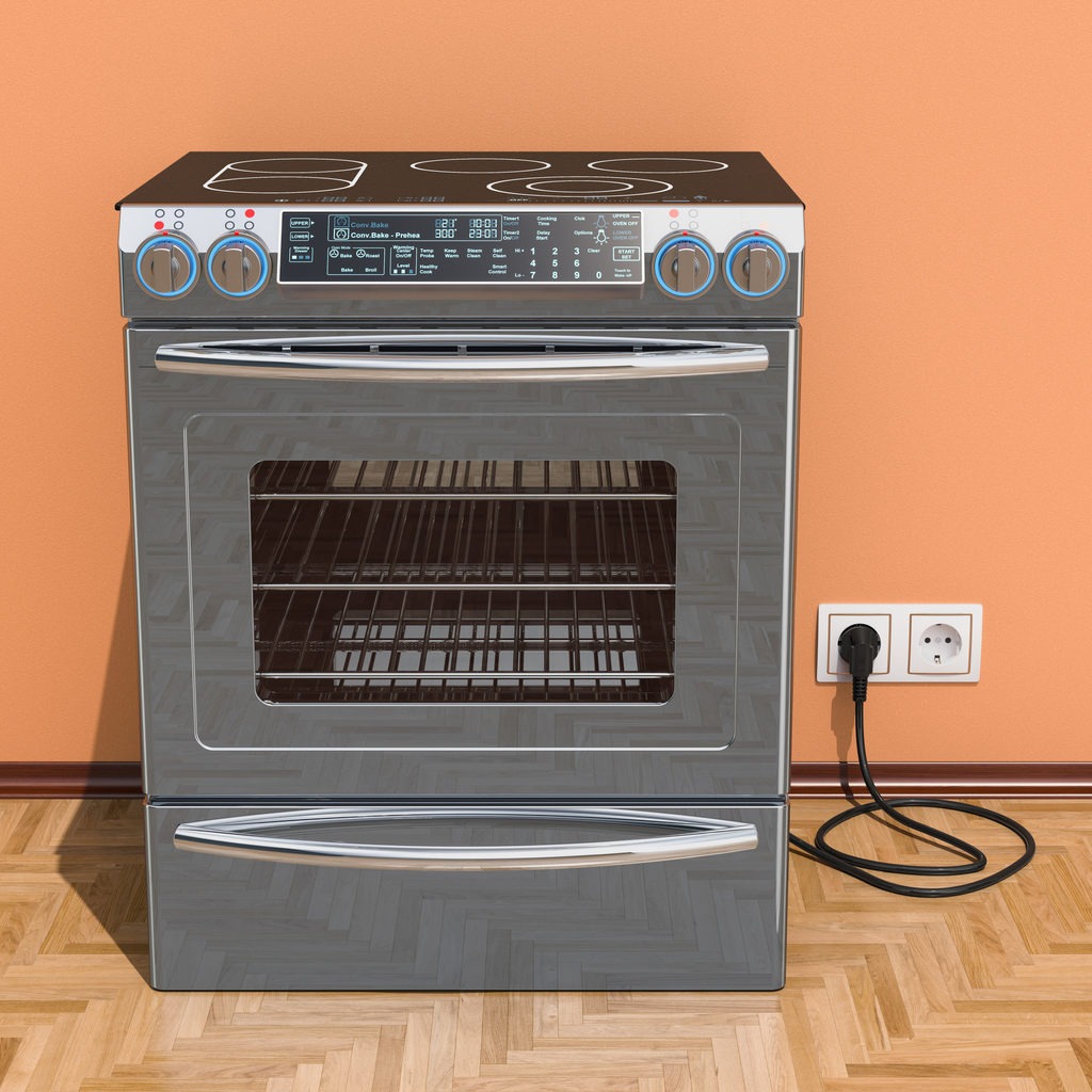 Slide-in induction cooker at top of an oven