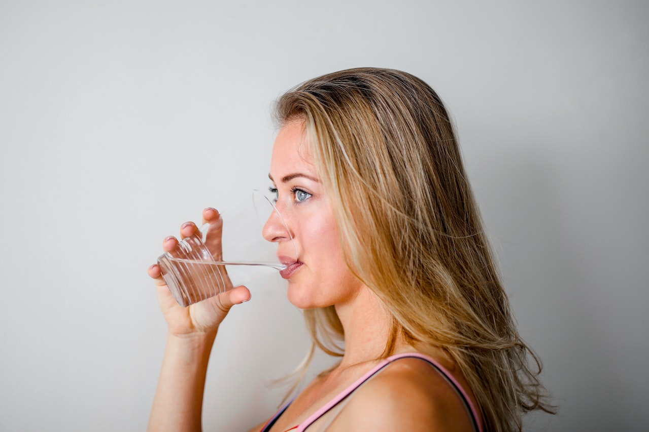showing a woman drinking water