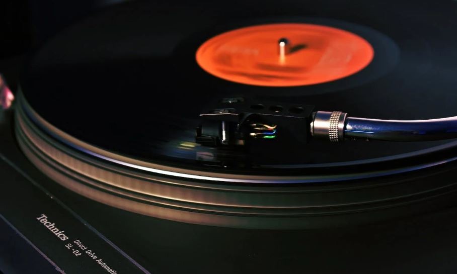 a close up photo of a black turntable