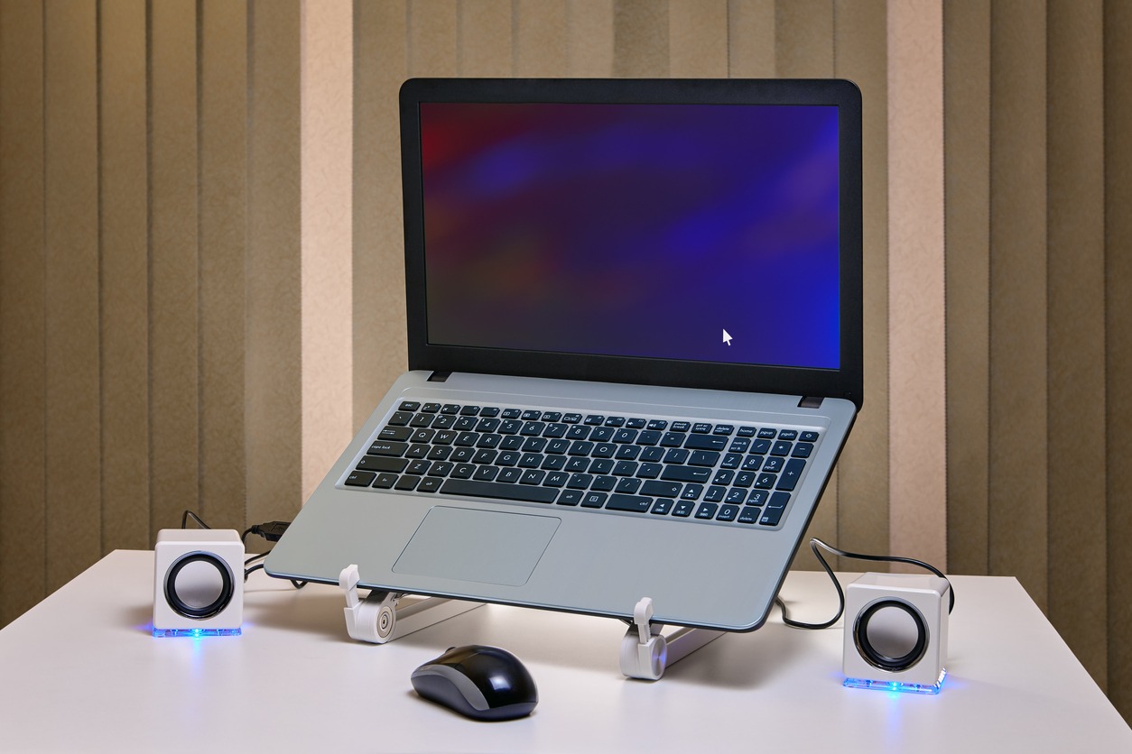 Apple laptop on ergonomic stand