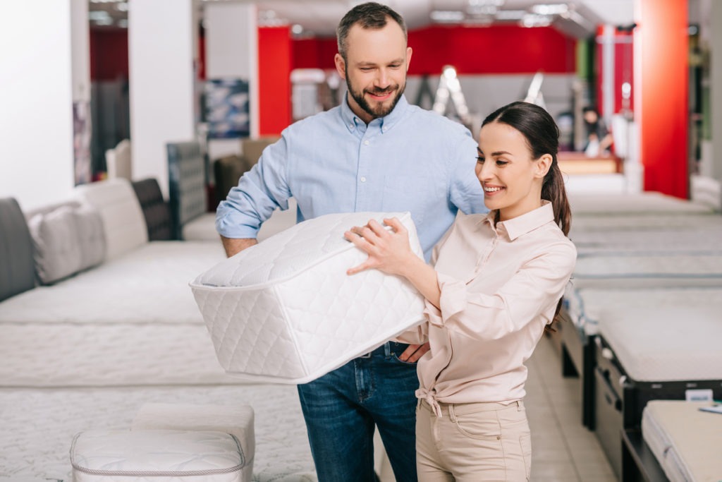 Couple buying a new mattress