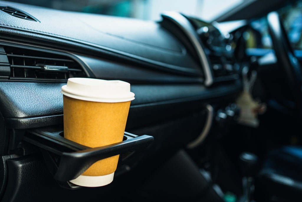 Cup of coffee in a car cup holder
