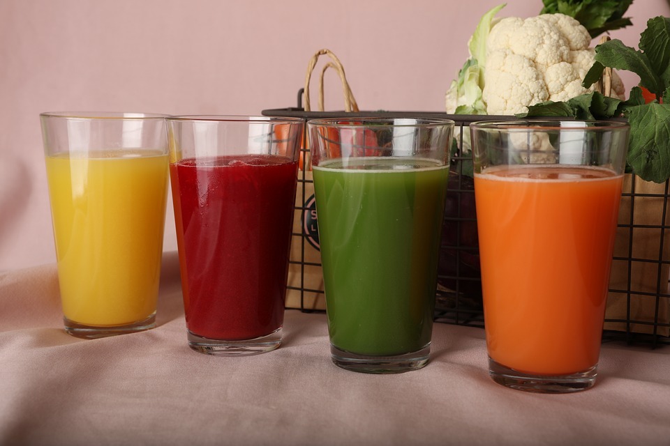 Different flavors of juice on top of a table