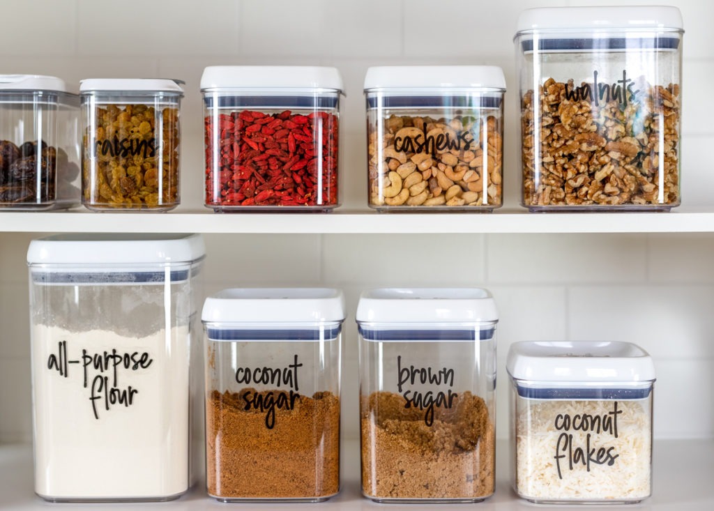 Neatly organized and labeled baking ingredients in BPA-free plastic storage containers
