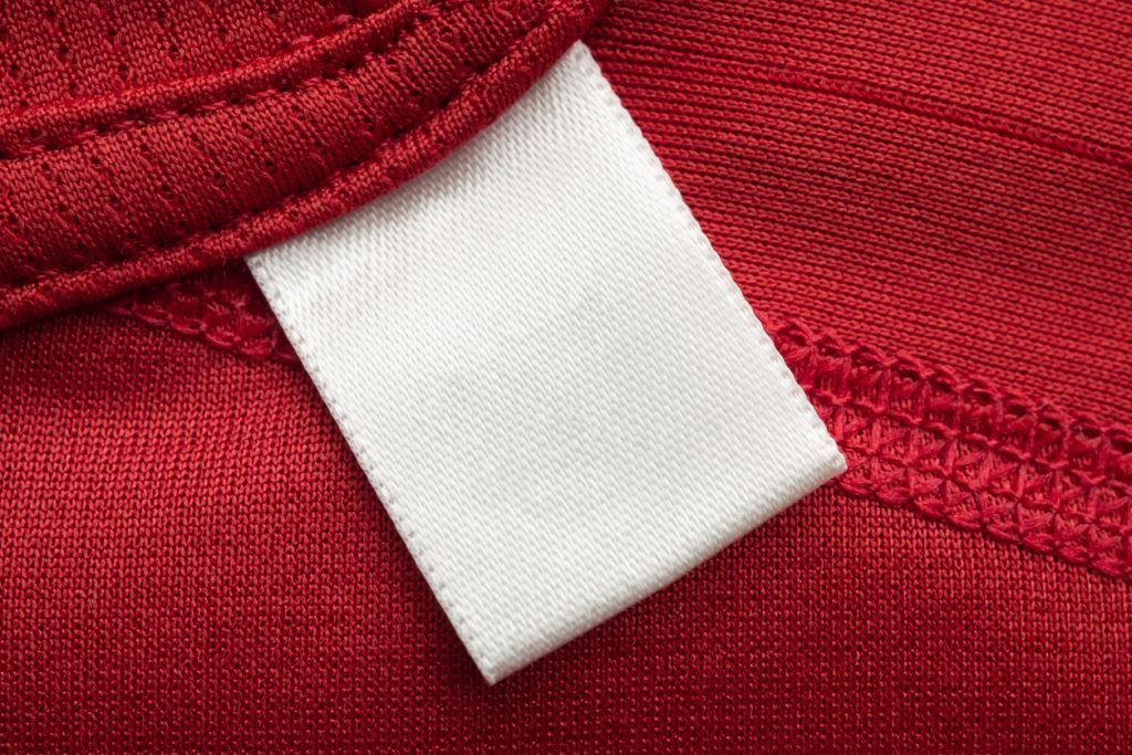 The stitching on a red sports shirt