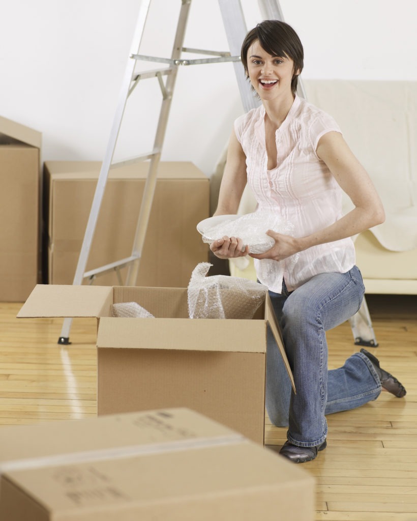 Young-Woman-Packing-Cardboard-Boxes