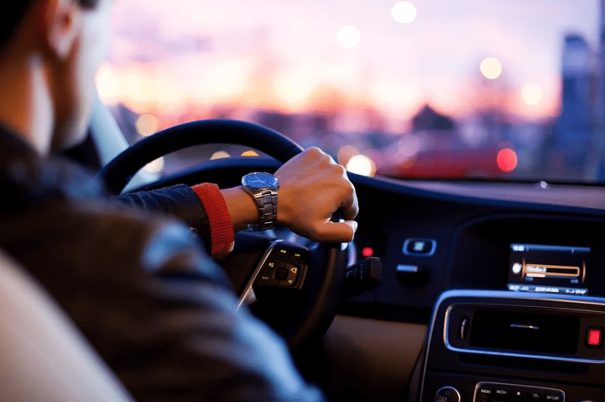 car-interior-man-a-hand-on-the-steering-wheel-watch