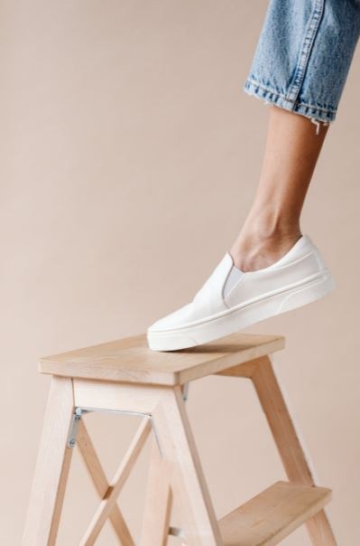 the-foot-of-a-person-on-a-stepping-stool