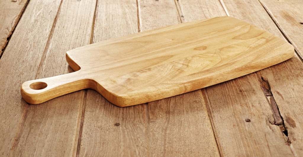 Wood cutting board on wooden background