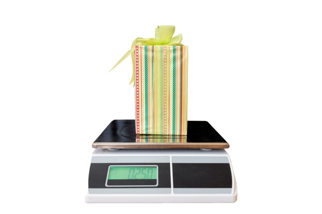 Yellow gift box weigh on digital weight machine