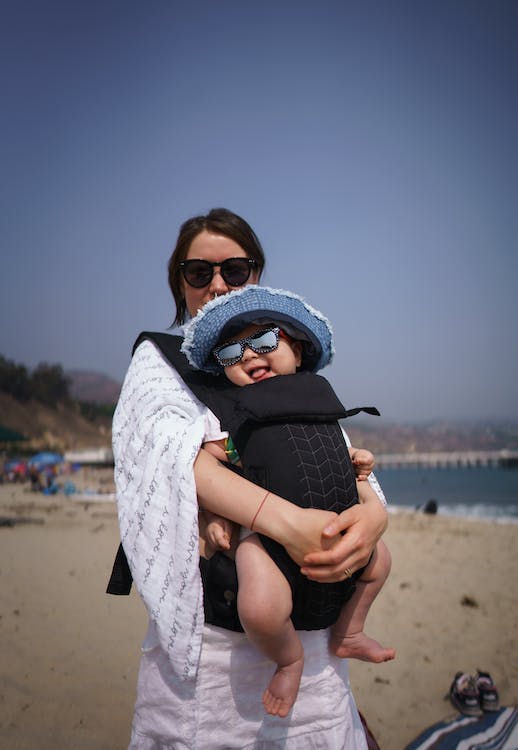 A mother and a baby in a carrier