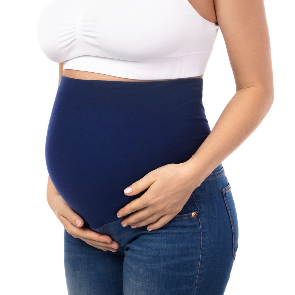 A pregnant woman wearing an over-the-belly maternity pants