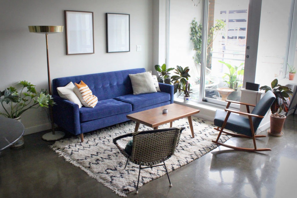 Modern apartment with minimalist mid-century modern interior design