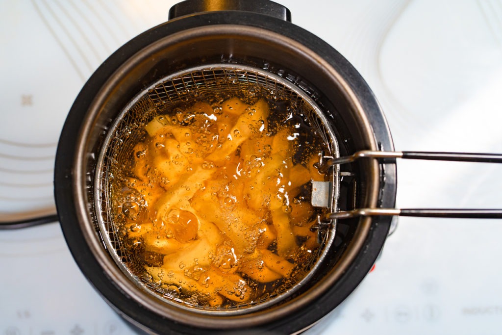Top view of oil boiling in a deep fryer