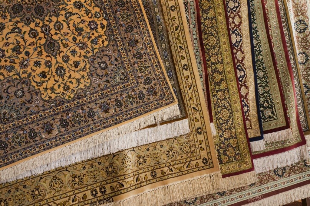 Various Persian carpet rugs in different colors