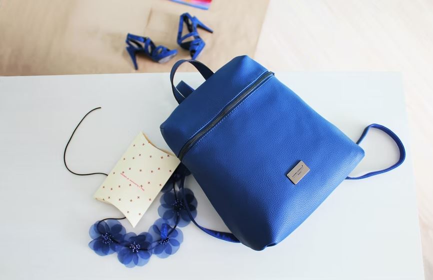 a blue leather backpack purse