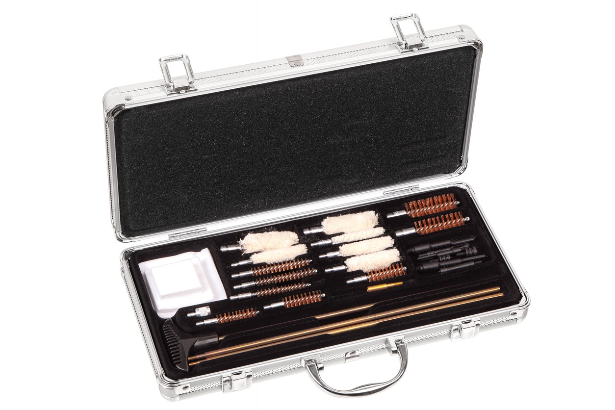 A cleaning gun kit on a metal case