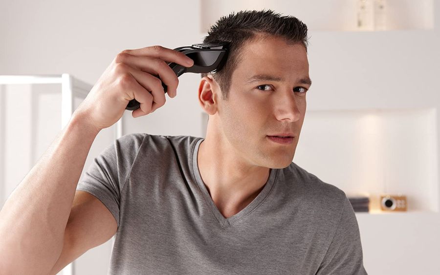 a-man-trimming-his-hair-using-a-hair-clipper