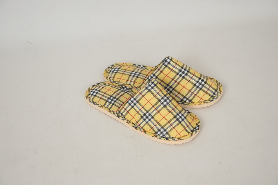 a pair of checked yellow slippers