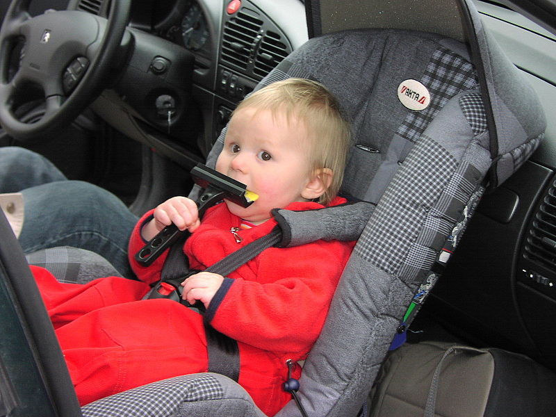 carseat-with-baby-in-red-jacket