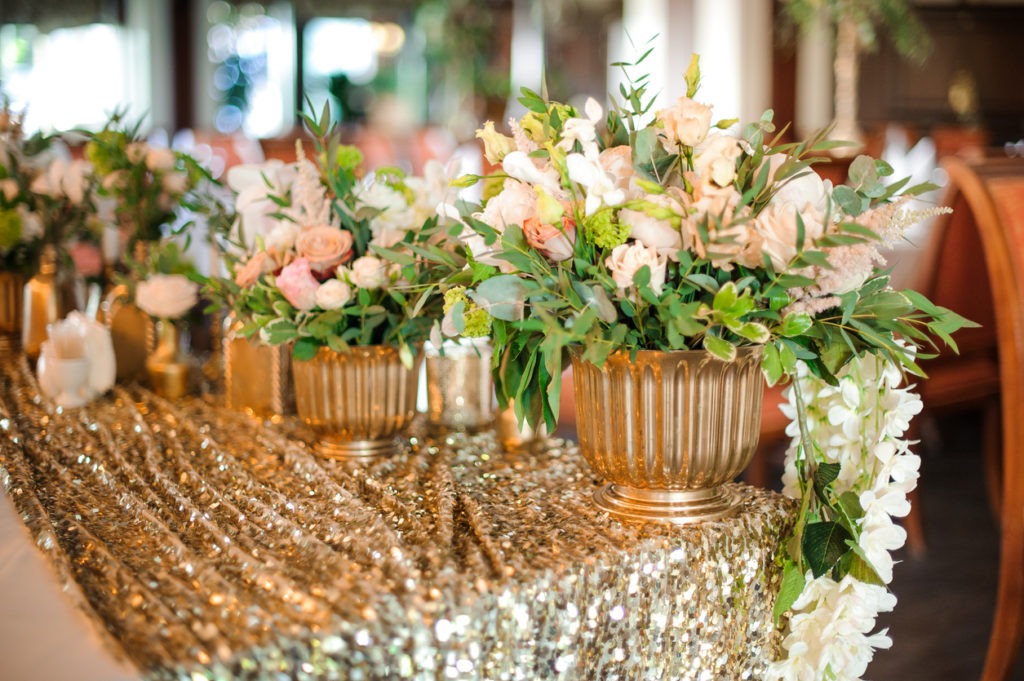 Golden pots with beautiful and tender white roses
