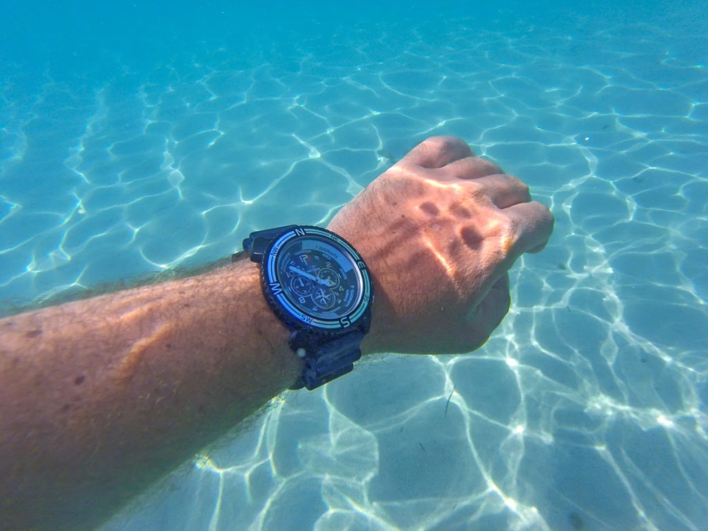 Hand with watch under the sea
