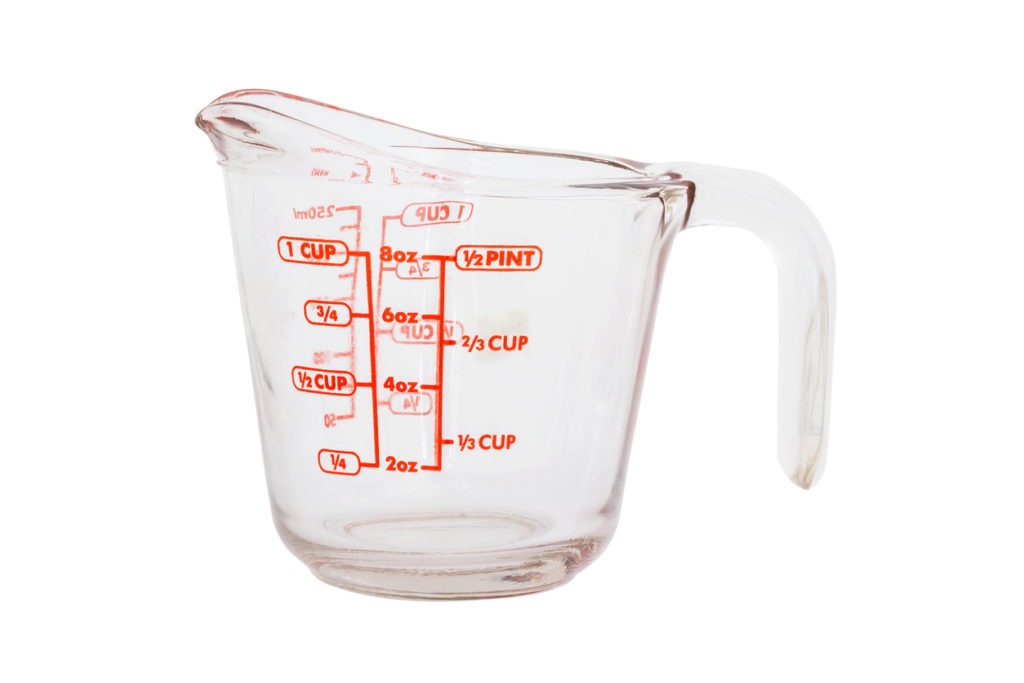 Empty measuring cup isolated on white background with clipping path.