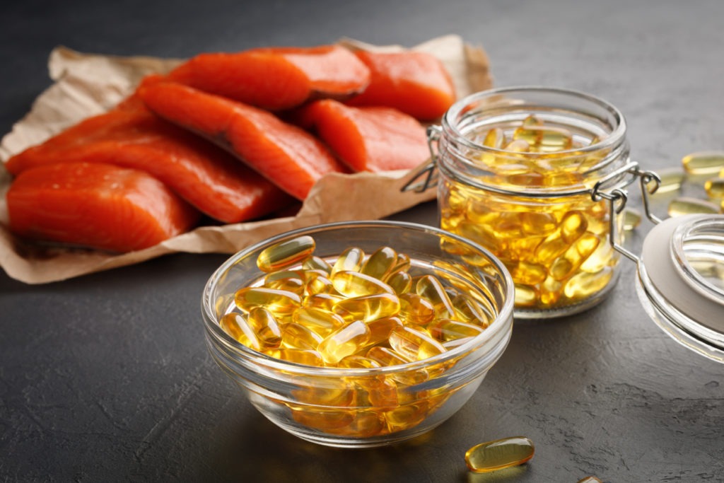 Omega 3 capsules and salmon red fish