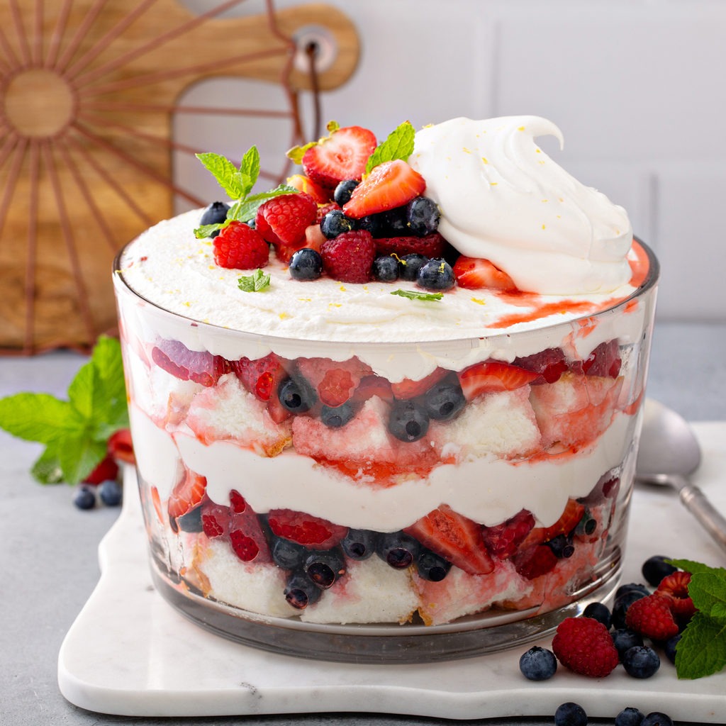 Summer berry red, white and blue trifle with angel food cake in a large bowl