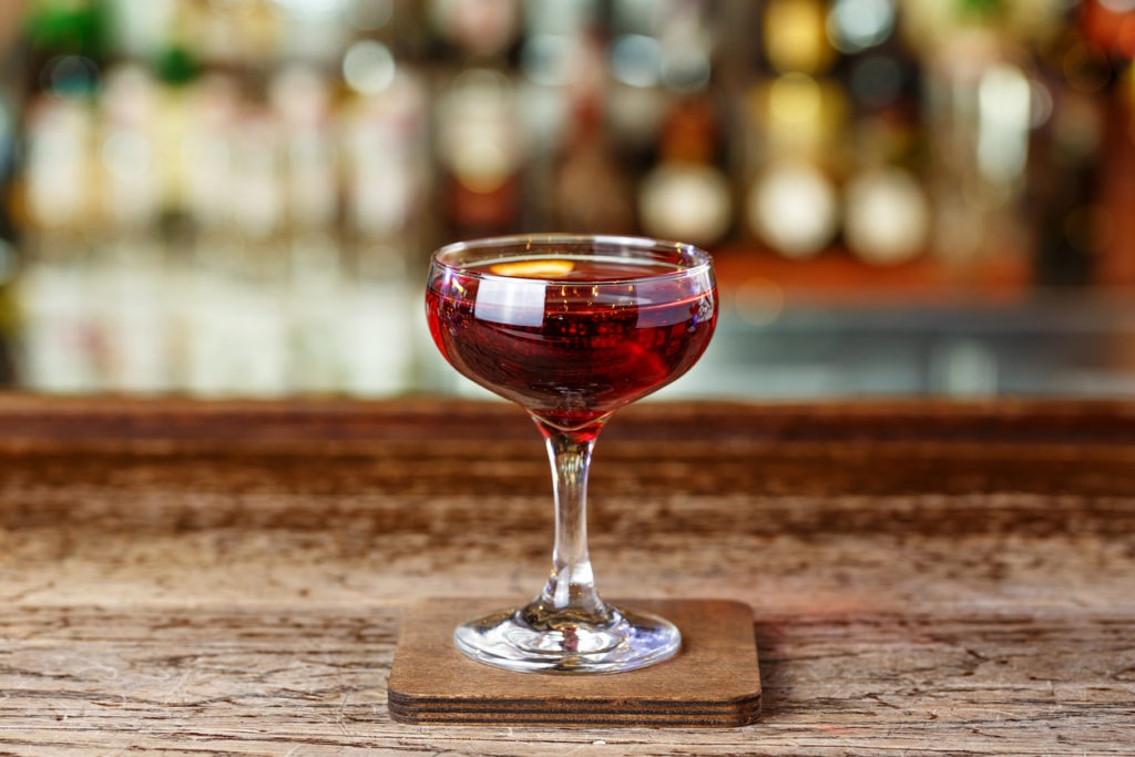 A whiskey-based cocktail with vermouth, Manhattan. Cocktail aperitif on the bar in the nightclub