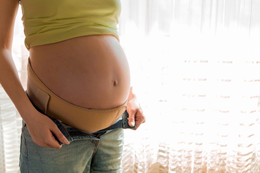 woman wearing maternity belt