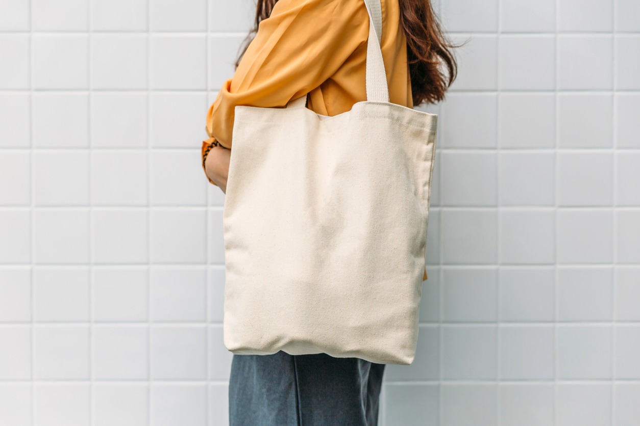 woman with a canvas tote bag