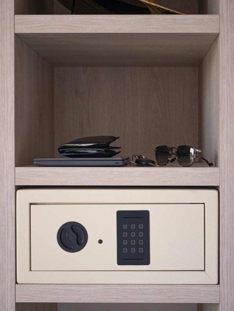 A hotel room safe in a cabinet