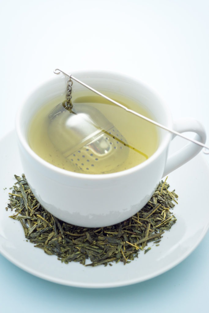 Green tea with a stainless tea infuser