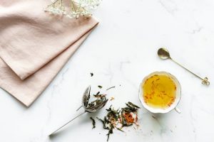 Herbal-tea-in-a-white-ceramic-teacup-300x200
