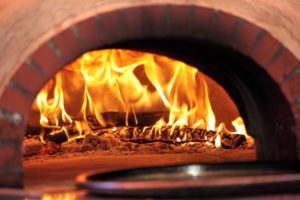 Image-of-a-pizza-oven-with-fire-at-a-pizzeria
