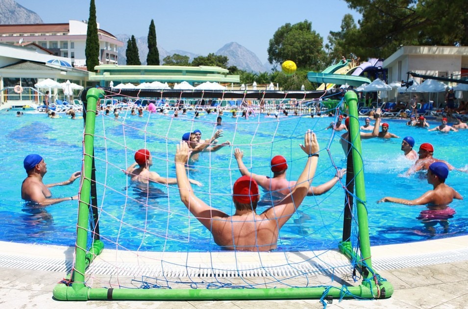 Men-playing-a-ball-game-at-the-pool