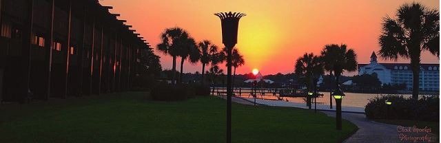 Tiki torch silhouette with sunset