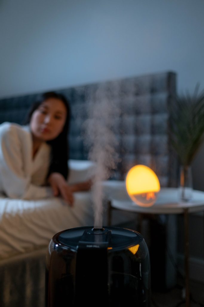 Woman-in-the-bedroom-with-humidifier-scaled