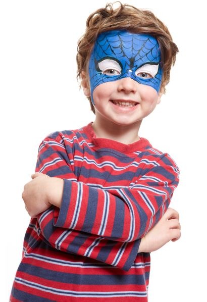 Young boy with face painting superhero