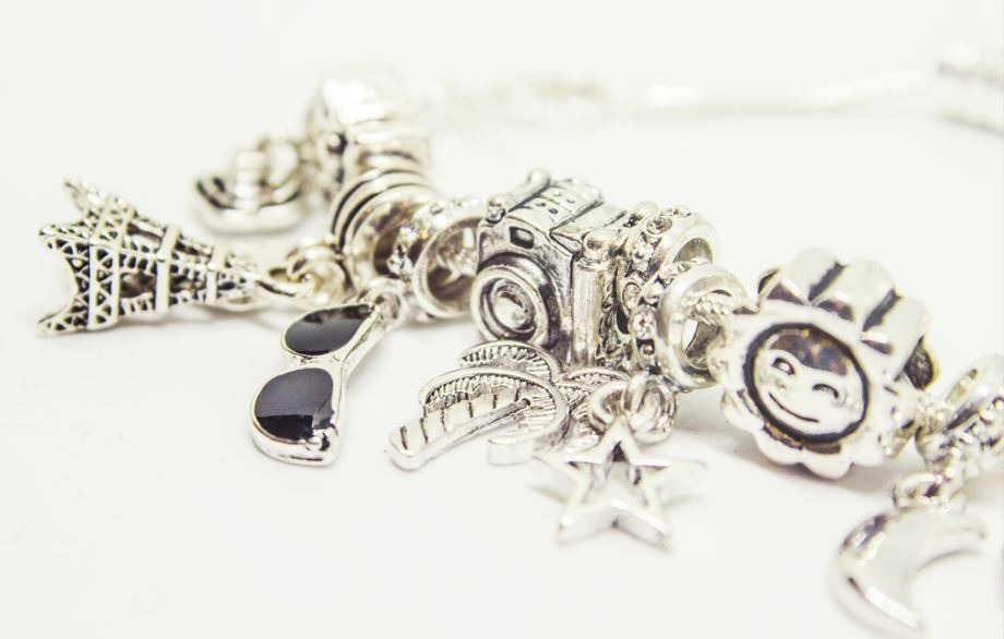 a zoomed in image of a bracelet with charms