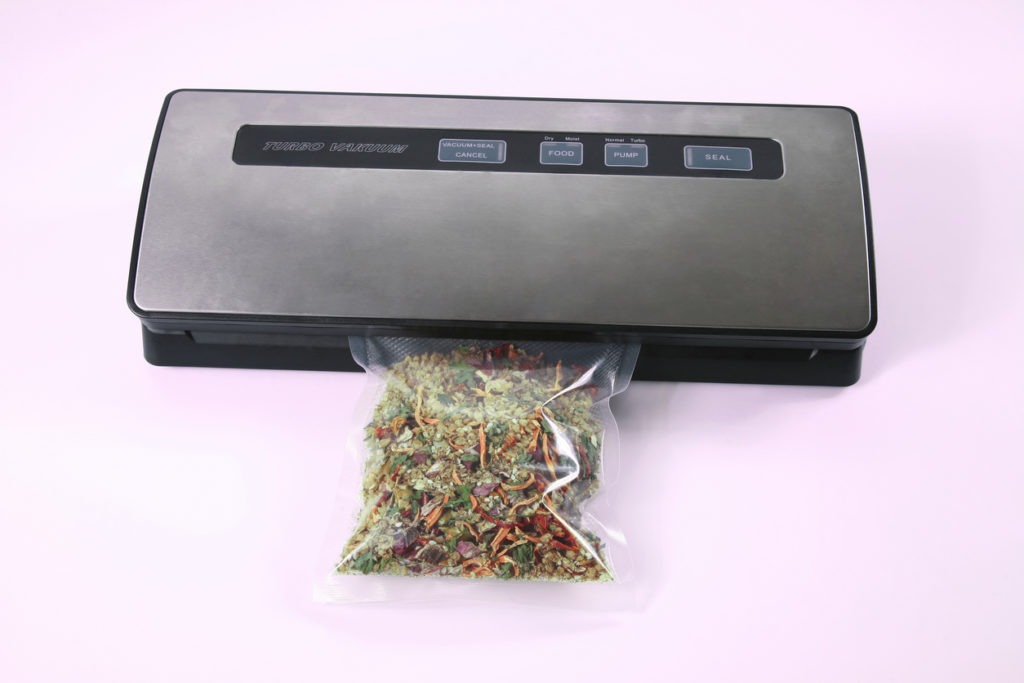 dry food being sealed with a vacuum sealer