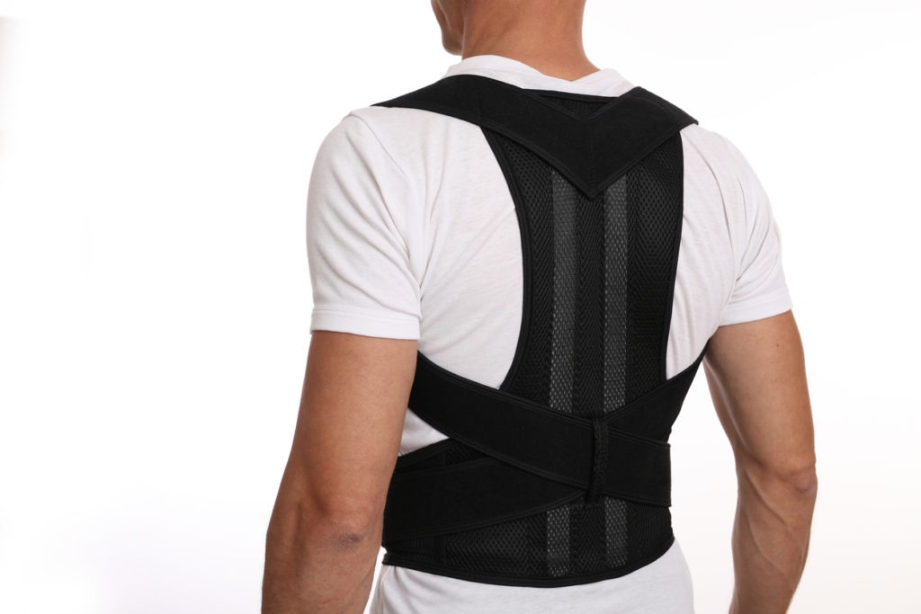 man wearing back support belt for back.