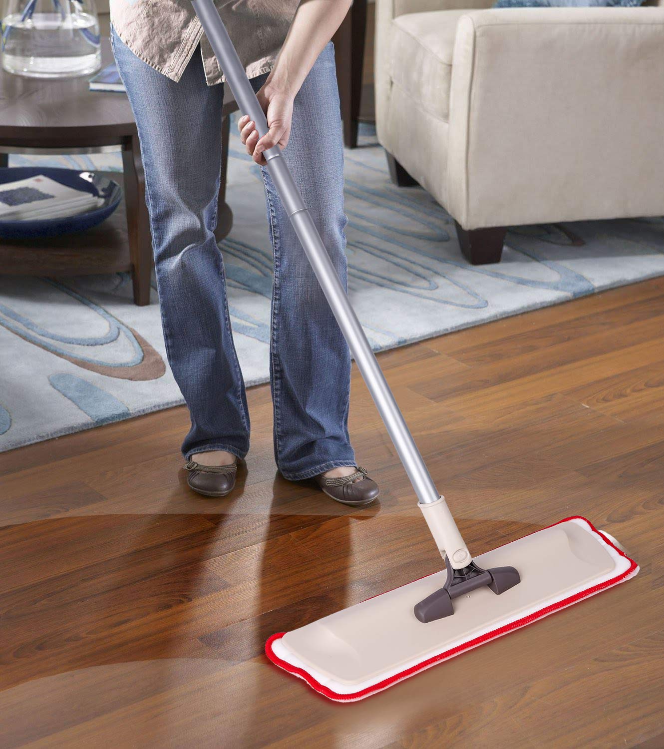 person-cleaning-a-wooden-floor-with-a-flat-microfiber-mop