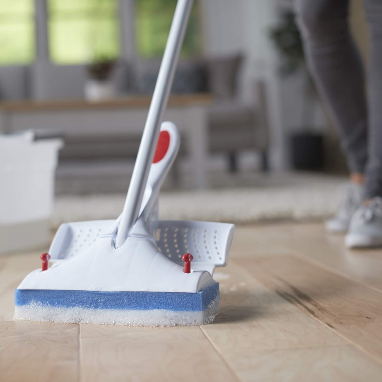 person-cleaning-a-wooden-floor-with-a-sponge-mop