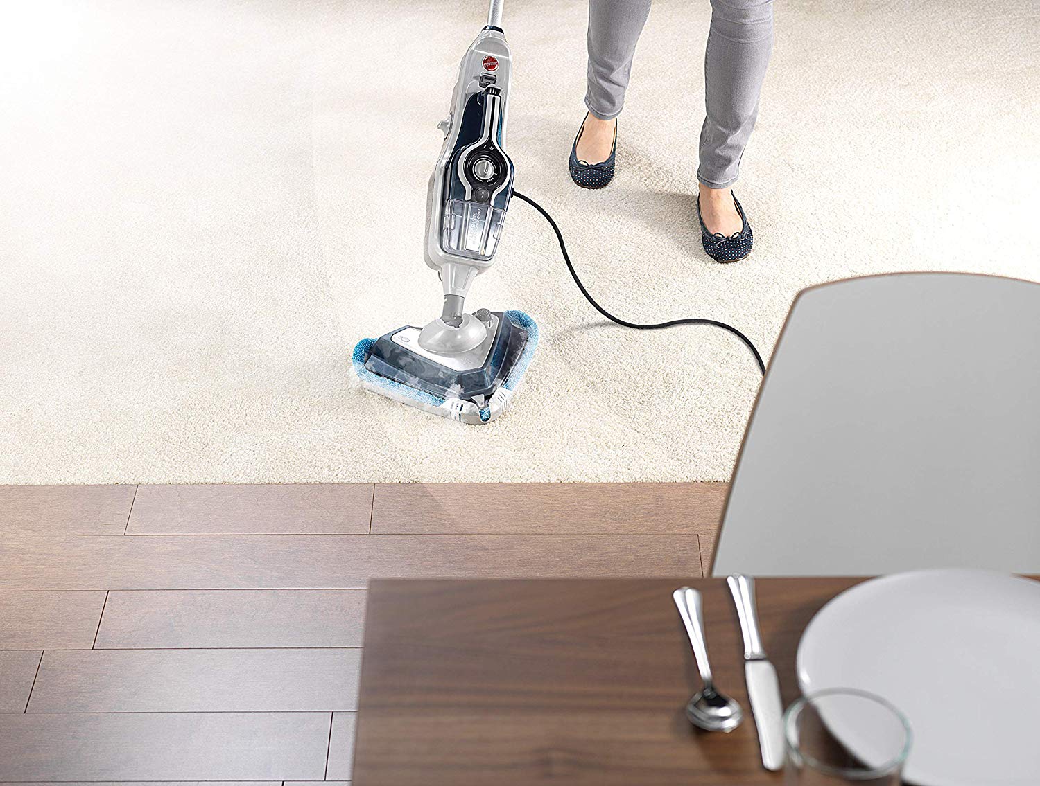 woman-cleaning-a-carpet-using-a-steam-mop